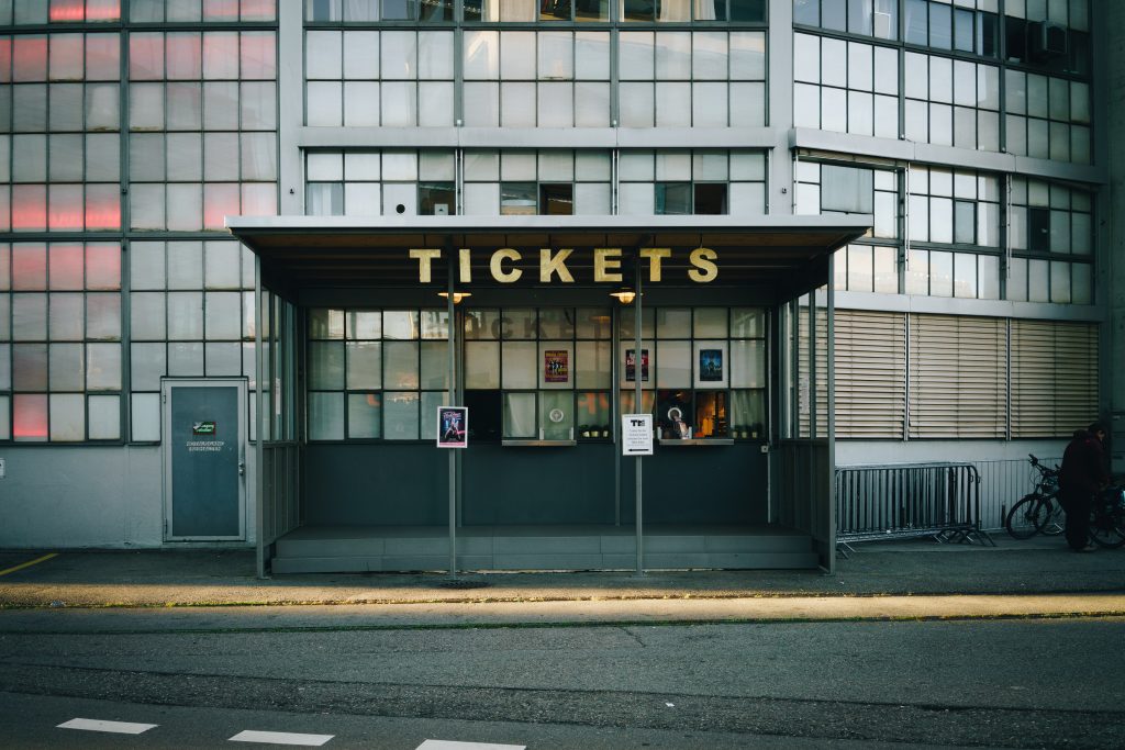 A tickets booth in a glass building