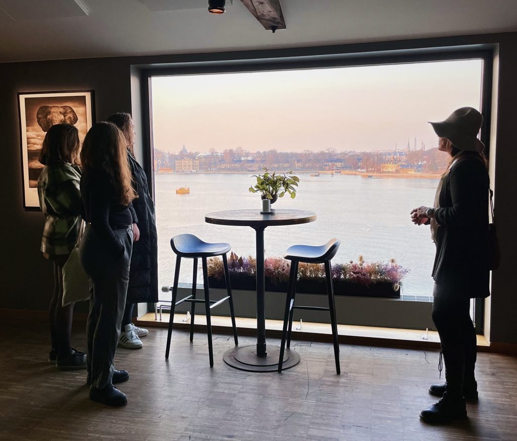 Photo of people standing by window