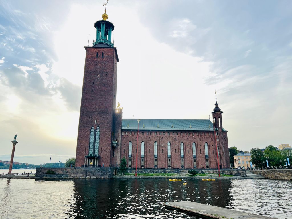 My photo of Stockholm City Hall from the outside, with a stretch of water in between, reflecting the 'Stockholm Waters SUNNAN Discovery' theme.