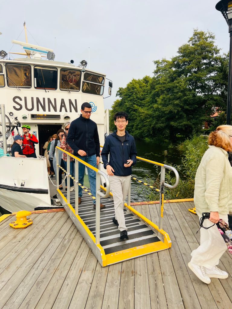 Photo I took of my two friends stepping off the SUNNAN boat at a station near Ekerö during our Stockholm Waters adventure.