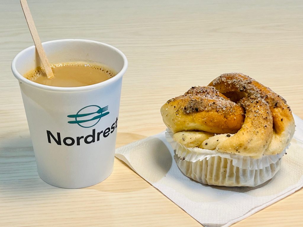 A picture of a Swedish fika, one of Swedish culture, with coffee and cinnamon buns