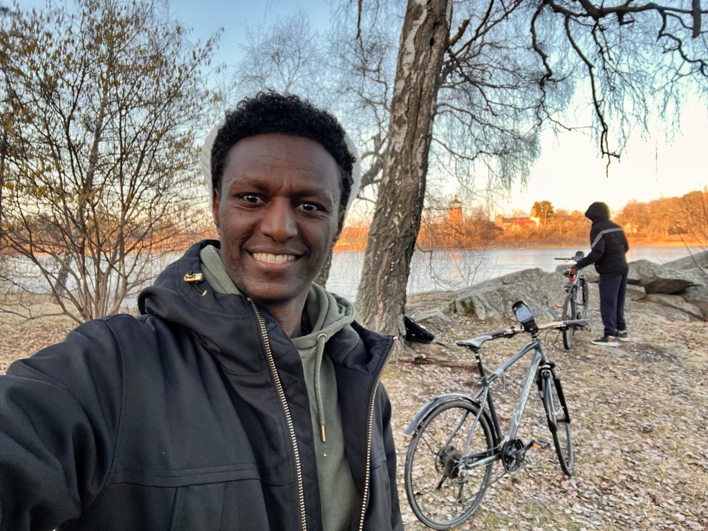 My friend and I cycling in Stockholm guide along the water.