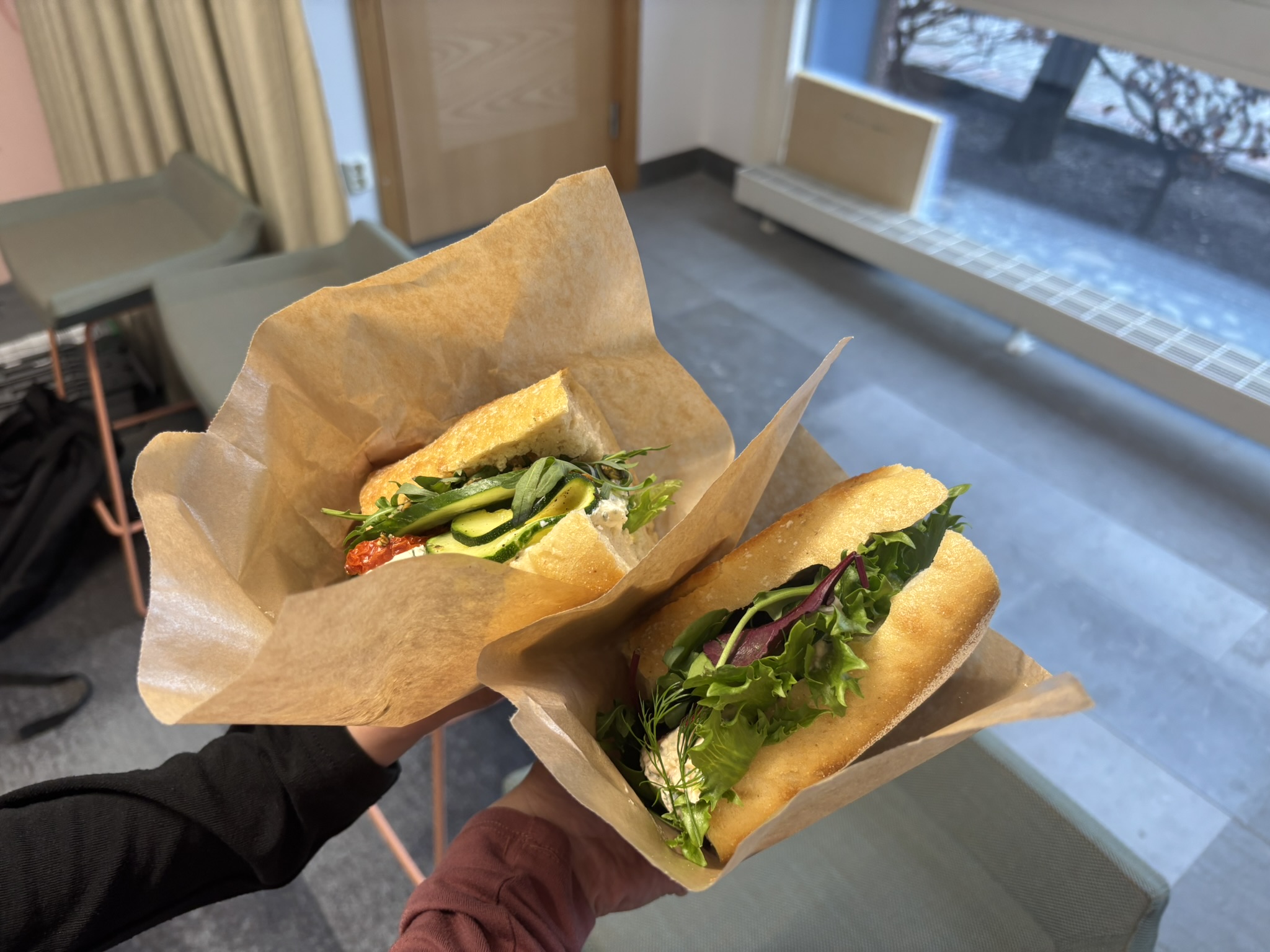 Two sandwiches with lettuce and zucchini