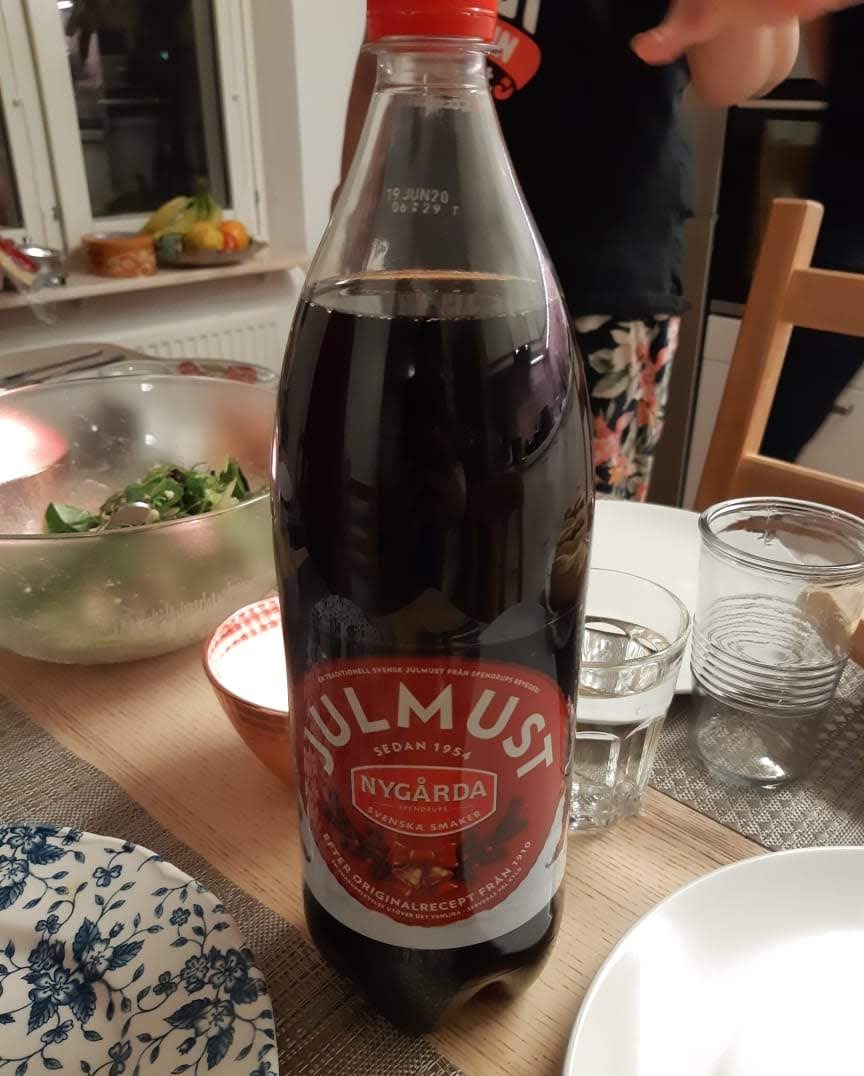 A bottle of julmust with a red label
