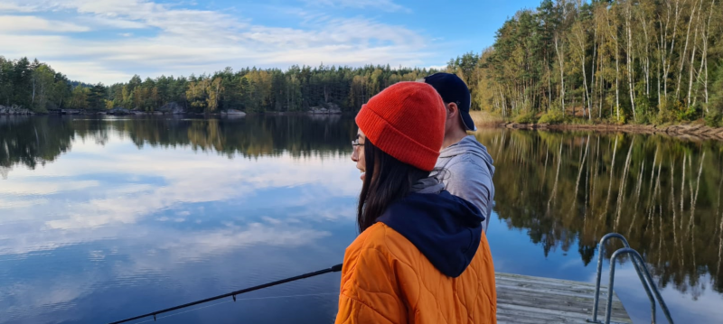 Helen standing by a lake