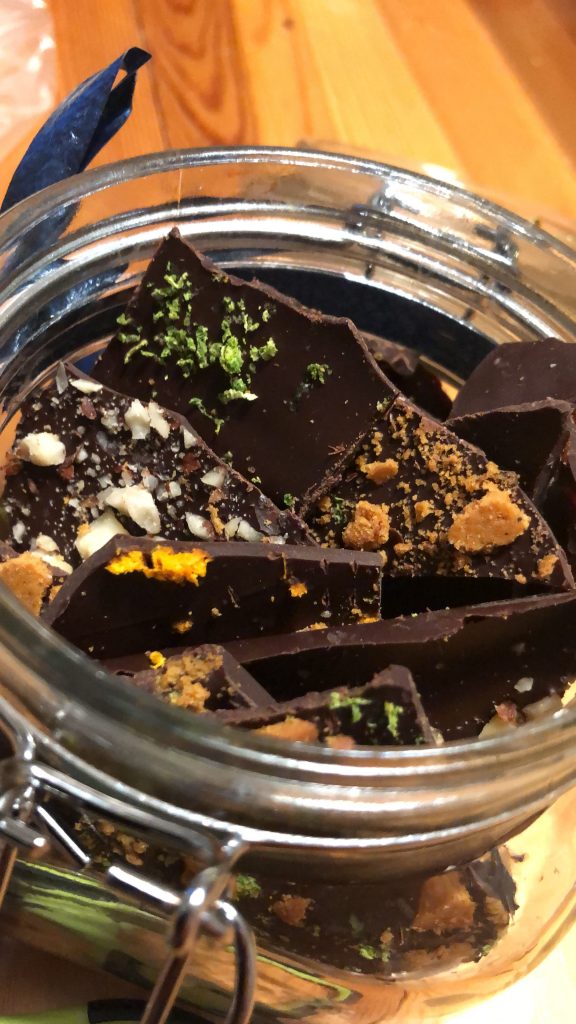 The top of a jar with shards of chocolate inside