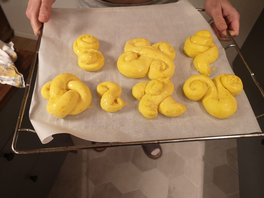 Lussebullar dough shaped and ready to go into the oven