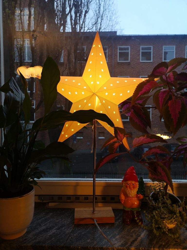 A lit up star standing on my window sill