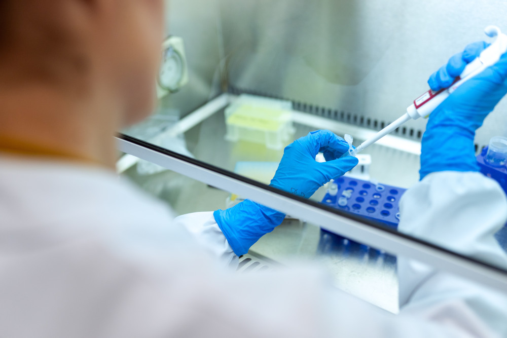 Person working at the cell culture hood
