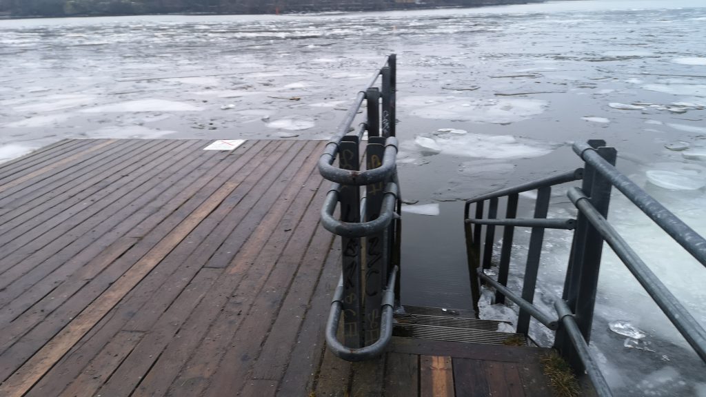 image of stairs into the icy water