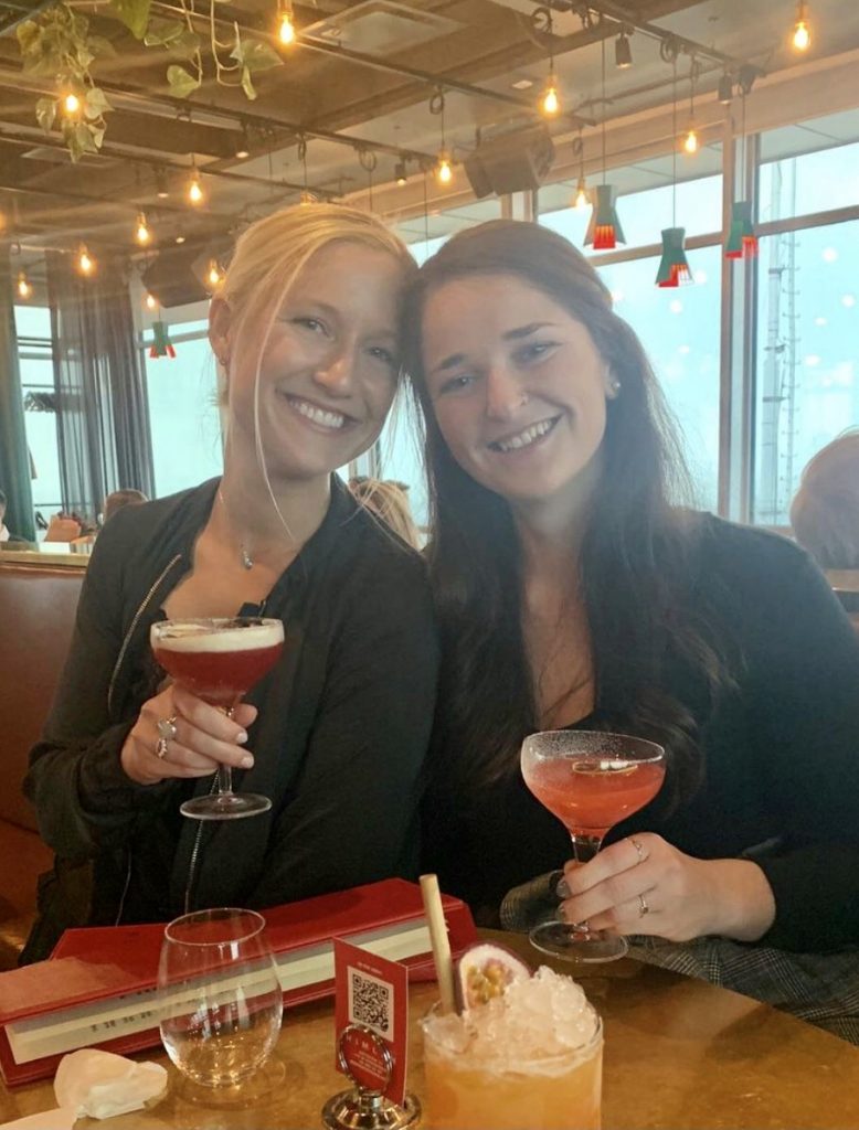 two friends enjoying cocktails