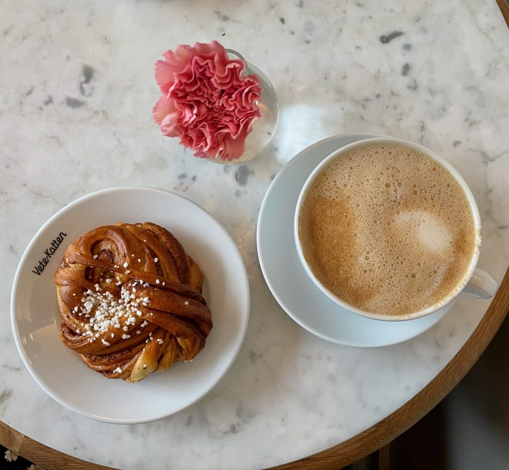 photo of coffee and cinnamon bun
