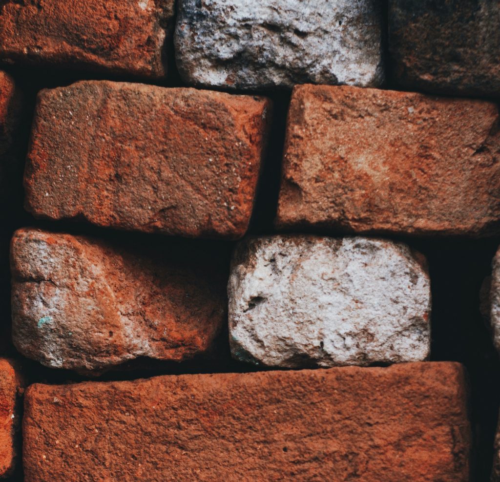 A ton of bricks used to describe the saying "hit in the face like a ton of bricks."