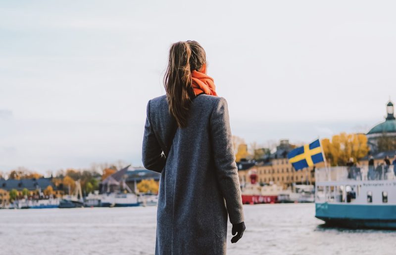 Photo of girl looking over water