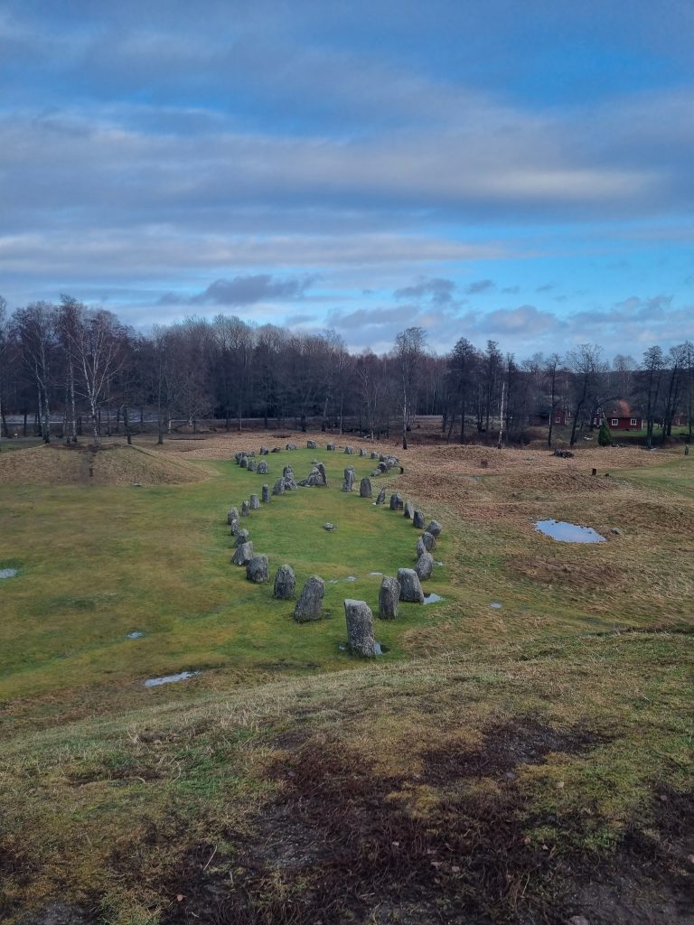 Ancient runestones on a field.