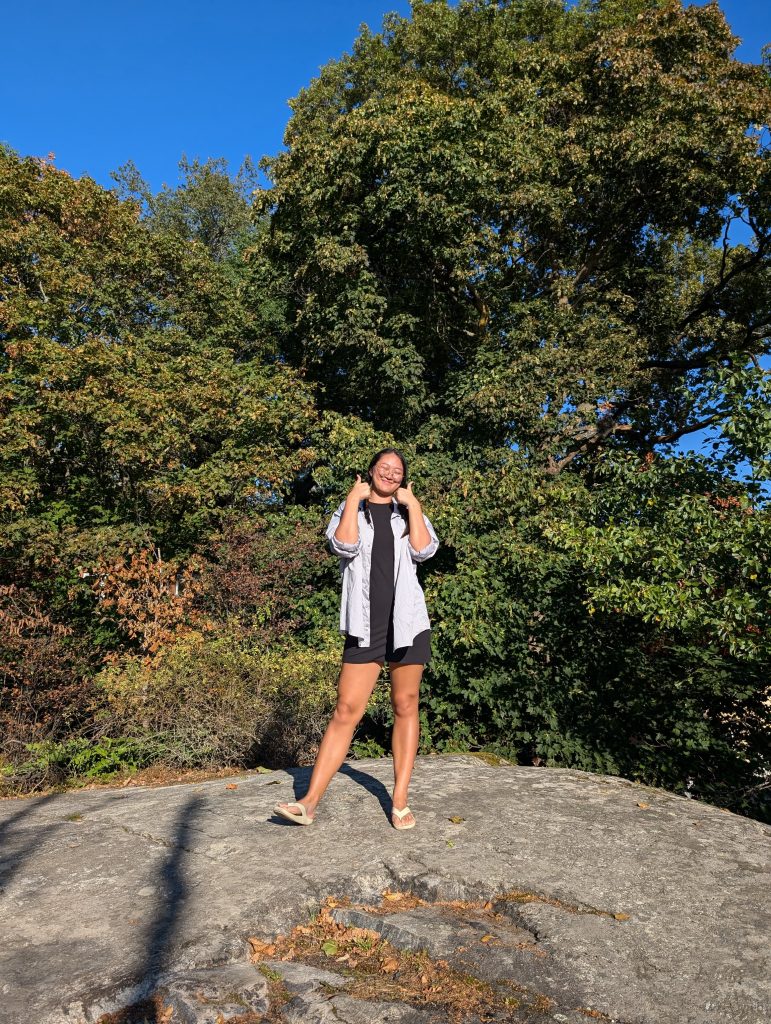 A girl posing in the sun after a swim