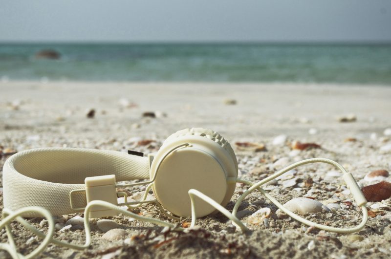A headphone by the beach. Relaxing after securing a spot at KI is important.