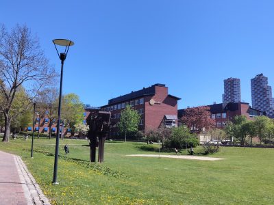 grass in front of brick houses on KI campus Solna